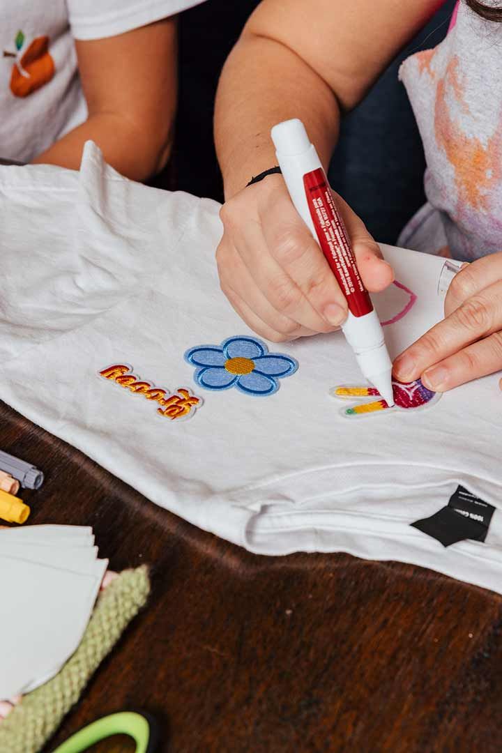 Adding patches and designs to tshirt with fabric markers and glue